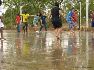 ... to dance in the rain and start a game of barefoot soccer in the rain