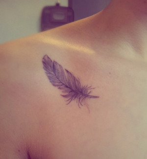 Home » Chest Tattoos » Realistic feather tattoo on chest