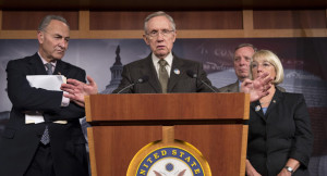 Senate Majority Leader Harry Reid of Nev., center, accompanied by ...