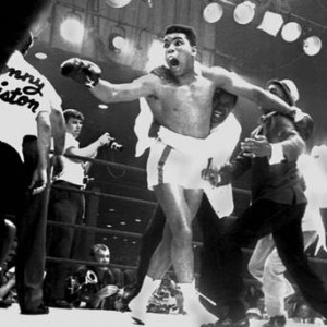 Cassius Clay celebrates after winning the heavyweight championship of ...