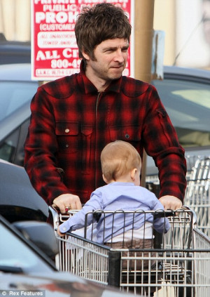 Modern dad: Noel Gallagher pushes his son Donovan Rory Gallagher in a ...