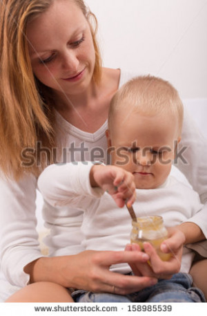 stock-photo-mother-feeding-baby-food-to-baby-158985539.jpg