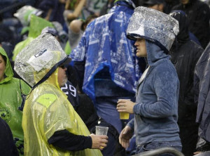 Seattle Seahawks fans wear official approved NFL security bags as rain ...
