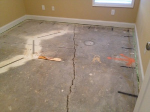 Cracking floors are a sign of foundation settlement. As seen in the ...