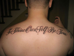 Amazing Quote Tattoo On Man Upperback