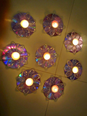Beautiful candle holders created made out of old CD's & plastic spoons ...