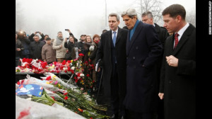 Secretary of State John Kerry, wearing a blue scarf, visits a ...