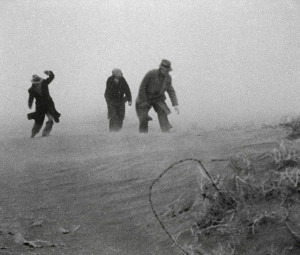 Men walk through a dust storm in Garden City, Kansas, on April 17 ...