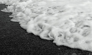 Description Sea foam on the shore.jpg
