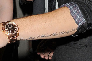 After leaving us to guess what the one up his arm says, Liam has now ...