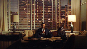Don drinks alone in his office. (Image: AMC)