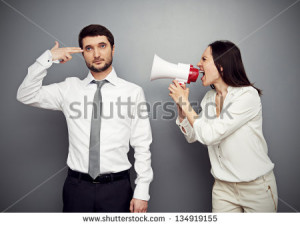 angry woman shouting at the tired man over dark background - stock ...