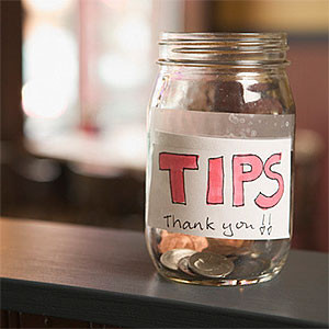 Still life of a nearly empty tip jar © Big Cheese Photo, SuperStock