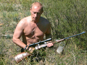 PHOTO: Russian President Vladimir Putin carries a hunting rifle in the ...