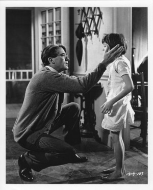 Atticus talking to his daughter, Scout