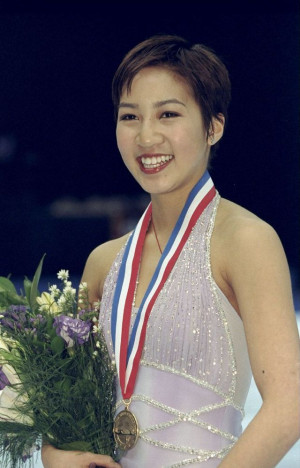 Michelle Kwan poses with her gold medal at the U.S. Figure Skating ...