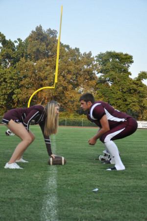 Cheerleader and football player couple taking pictures!