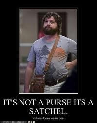 ... purse, its a satchel. Indiana Jones wears one:) lol love the Hangover