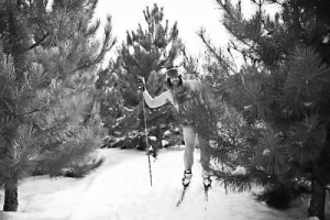 Cross-country skier Doran Oâ Brien stands behind a fir tree, wearing ...