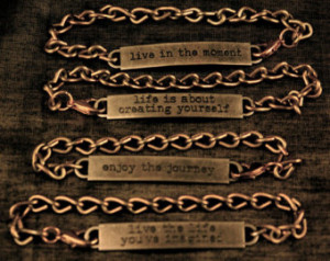 Metal ID type chain bracelets with different 'life' sayings. ...