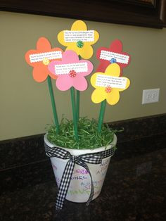gift. Students signed their name to a painted clay pot. Foam flowers ...
