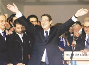 Newly elected Greek Cypriot leader Anastasiades waves to supporters.