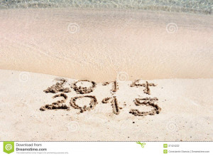 ... 2015 on a beach sand, the wave is starting to cover the digits 2014