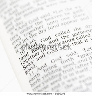 Selective focus of Genesis verses in open Holy Bible. - stock photo