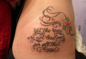 flower tattoo with tribal vines and a lovely quote