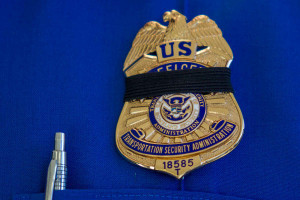 Transportation Security Administration employee wears a black ribbon ...