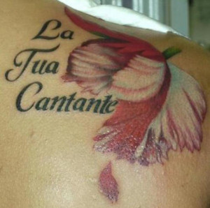 Flower tattoo with Italian love quote.