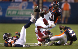 30, 2007 - Denver Broncos D.D. Lewis (54) and Karl Paymah (41) up end ...