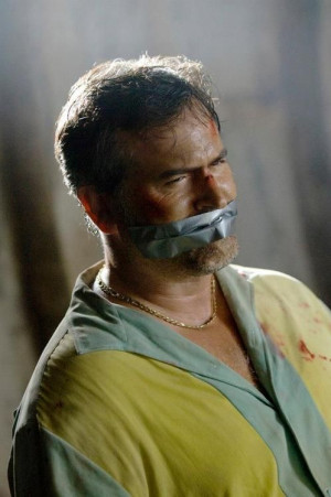 Bruce Campbell all tied up as Sam Axe - Burn Notice season 1 finale