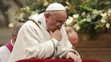 Pope Francis kneels as he leads the Christmas night mass in Saint ...