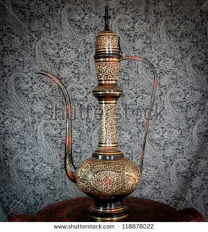 Old Indian or Arabic style classic Tea pot. Surahi. - stock photo