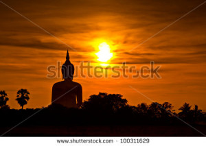 Big buddha statue in sunset thailand - stock photo