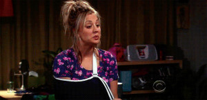 Penny Can’t stop Lauging With a Broken Arm On Big Bang Theory Gif