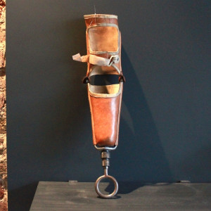 antique leather prosthetic arm