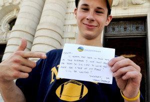 with travis travis showing a 1 bill autographed by travis pastrana