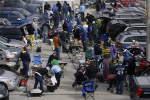 Fans tailgate outside Miller park before an Opening Day baseball game ...
