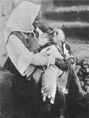 Hellenic refugees. A woman a small child, who probably had a broken ...