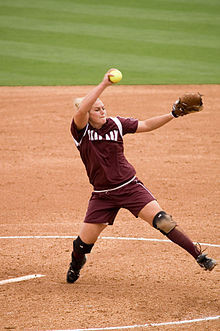 still picture of fast pitch player Megan Gibson pitching the ball in ...