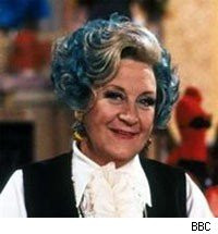 Mollie Sugden as Mrs. Slocombe