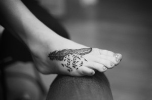 feather tattoos on foot