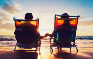 Senior couple of old man and woman sitting on the beach watching ...