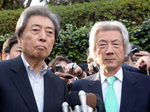 ... his supporter, fellow ex-Prime Minister Junichiro Koizumi, looks on
