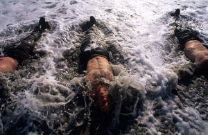 SEAL trainees in the frigid surf at a beach in Coronado, California.