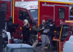 ... gunman held at least five people hostage. Four died in this incident