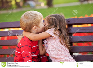 Love concept. Couple of kids loving each other hugging and kissing.