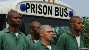 Are there more US black men in prison or college?